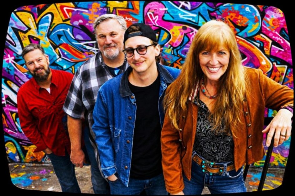 Band members of Huckle Buck Highway (group of four) posing in front of a bright graffitied wall