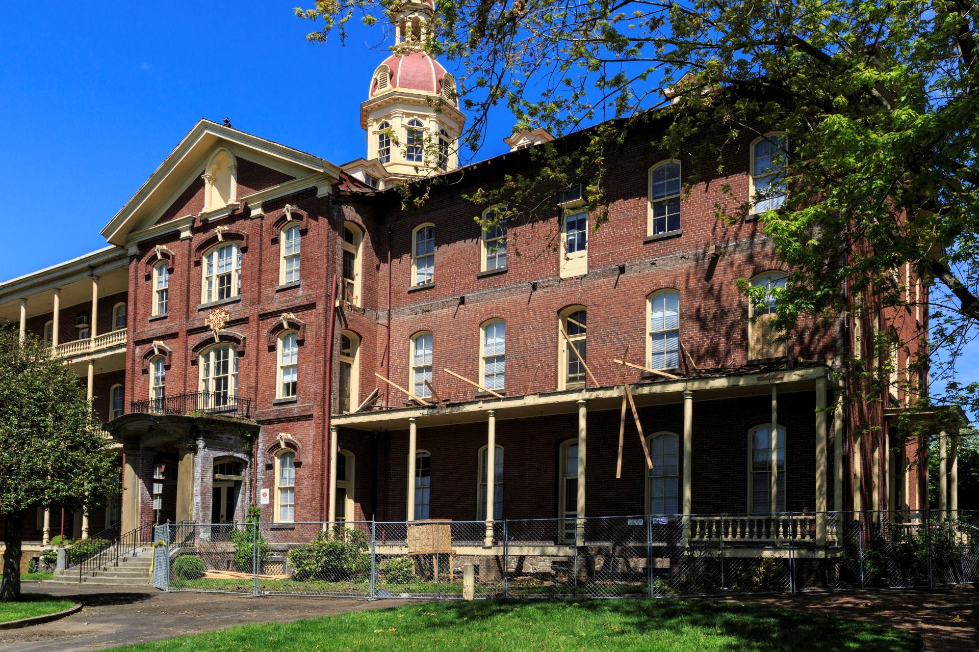 Southeast front porch of Providence Academy under construction